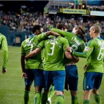 Sounders players celebrate as Brad Evans makes the score 3-0. 