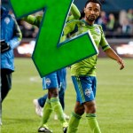 Sounders defender James Riley shows his support for Sounders midfielder Steve Zakuani after the match. 