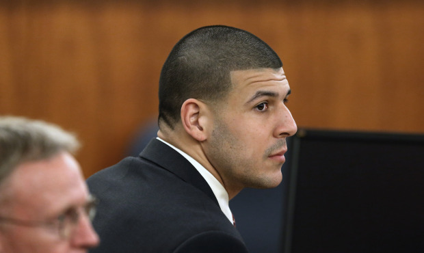Former New England Patriots NFL football player Aaron Hernandez, right, sits besides his attorney C...