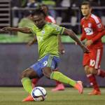 
              Seattle Sounders forward Obafemi Martins (9) kicks the ball against FC Dallas in the first half of an MLS soccer western conference semifinal playoff match, Sunday, Nov. 1, 2015, in Seattle. (AP Photo/Ted S. Warren)
            