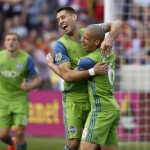              Seattle Sounders' Osvaldo Alonso (6) celebrates after scoring a goal with Seattle Sounders' Clint Dempsey during the first half of an MLS soccer game against Real Salt Lake on Saturday, March 12, 2016, in Sandy, Utah. (AP Photo/Kim Raff)
            