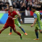 
              Real Salt Lake's Juan Manuel Martinez, left, looks to pass the ball past Seattle Sounders' Cristian Roldan (7) during the first half of an MLS soccer game on Saturday, March 12, 2016, in Sandy, Utah.  (AP Photo/Kim Raff)
            