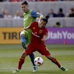 
              Seattle Sounders' Clint Dempsey, left, and Real Salt Lake's Tony Beltran (2) compete for the ball during the first half of an MLS soccer game on Saturday, March 12, 2016, in Sandy, Utah.  (AP Photo/Kim Raff)
            