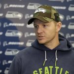 Seattle Seahawks offensive coordinator Darrell Bevell talks to reporters on Wednesday, Jan. 15, 2014, after NFL football practice in Renton, Wash. The Seahawks are to play the San Francisco 49ers on Sunday in the NFC championship. (AP Photo/Ted S. Warren)