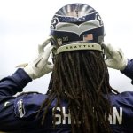 Seattle Seahawks cornerback Richard Sherman (25) puts on his helmet during NFL football practice on Thursday, Jan. 10, 2013, in Renton, Wash. The Seahawks are scheduled to play the Atlanta Falcons, Sunday, Jan. 13, in an NFC divisional playoff game. (AP Photo/Ted S. Warren)