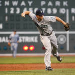 Seattle Mariners third baseman Kyle Seager throws out Boston Red Sox's Mookie Betts on an infield ground ball during the first inning of a baseball game at Fenway Park in Boston Friday, Aug. 14, 2015.(AP Photo/Winslow Townson)