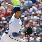 Texas Rangers starting pitcher Cole Hamels throws during the first inning of a baseball game against the Seattle Mariners, Monday, April 4, 2016, in Arlington, Texas. (AP Photo/Brandon Wade)
