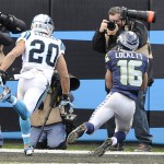 Seattle Seahawks wide receiver Tyler Lockett (16) makes a touchdown catch against Carolina Panthers free safety Kurt Coleman (20) during the second half of an NFL divisional playoff football game, Sunday, Jan. 17, 2016, in Charlotte, N.C. (AP Photo/Mike McCarn)