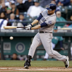 San Diego Padres' Chase Headley swings and misses to strike out against the Seattle Mariners in the first inning during a baseball game Monday, June 16, 2014, in Seattle. (AP Photo/Elaine Thompson)