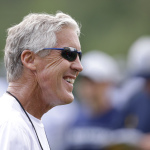 Seattle Seahawks head coach Pete Carroll smiles during practice, Saturday, Aug. 2, 2014, during NFL football training camp in Renton, Wash. (AP Photo/Ted S. Warren)