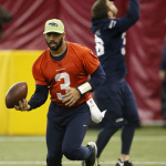 Seattle Seahawks quarterback Russell Wilson (3) runs drills during a team practice for NFL Super Bowl XLIX football game, Friday, Jan. 30, 2015, in Tempe, Ariz. The Seahawks play the New England Patriots in Super Bowl XLIX on Sunday, Feb. 1, 2015. (AP Photo/Matt York)