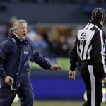 Seattle Seahawks head coach Pete Carroll, left, yells toward official Allen Baynes in the second half of an NFL football game against the St. Louis Rams, Sunday, Dec. 27, 2015, in Seattle. (AP Photo/John Froschauer)