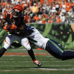 Cincinnati Bengals running back Giovani Bernard (25) is tackled by Seattle Seahawks strong safety Kam Chancellor in the first half of an NFL football game, Sunday, Oct. 11, 2015, in Cincinnati. (AP Photo/Frank Victores)