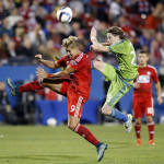 Seattle Sounders FC midfielder Erik Friberg (28) and FC Dallas forward David Texeira (9) go far a ball during the first half of an MLS soccer western conference semifinal playoff match Sunday, Nov. 8, 2015, in Frisco, Texas. (AP Photo/Brad Loper)