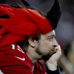 An Arizona Cardinals fan watches during the first half of an NFL football game against the Seattle Seahawks, Sunday, Jan. 3, 2016, in Glendale, Ariz. (AP Photo/Ross D. Franklin)