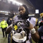 St. Louis Rams' Todd Gurley pulls off a glove as he leaves the field after an NFL football game against the Seattle Seahawks, Sunday, Dec. 27, 2015, in Seattle. The Rams won 23-17. (AP Photo/Stephen Brashear)