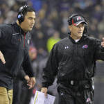 Utah head coach Kyle Whittingham, right, gestures from the sideline during the first half of an NCAA college football game against Washington, Saturday, Nov. 7, 2015, in Seattle. (AP Photo/Ted S. Warren)