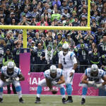 Seattle Seahawks fans at CenturyLink Field yell as Carolina Panthers quarterback Cam Newton  (1) awaits the snap in the second half of an NFL football game, Sunday, Oct. 18, 2015, in Seattle. (AP Photo/Elaine Thompson)