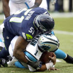 Seattle Seahawks outside linebacker Bruce Irvin (51) sacks Carolina Panthers quarterback Cam Newton (1) in the first half of an NFL football game, Sunday, Oct. 18, 2015, in Seattle. (AP Photo/Stephen Brashear)