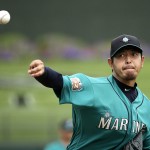 Seattle Mariners starting pitcher Hisashi Iwakuma throws during the first inning of a spring training baseball game against the Texas Rangers, Sunday, March 6, 2016, in Surprise, Ariz. (AP Photo/Charlie Riedel)