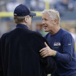 Seattle Seahawks coach Pete Carroll, right, talks with Seahawks owner Paul Allen before an NFL football game between the Seahawks and the Green Bay Packers, Thursday, Sept. 4, 2014, in Seattle. (AP Photo/Elaine Thompson)