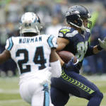 Seattle Seahawks tight end Jimmy Graham, right, runs past Carolina Panthers' cornerback Josh Norman (24) in the first half of an NFL football game, Sunday, Oct. 18, 2015, in Seattle. (AP Photo/Stephen Brashear)