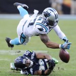 Carolina Panthers defensive back Robert McClain (27) breaks up a pass intended for Seattle Seahawks wide receiver Doug Baldwin (89) during the second half of an NFL divisional playoff football game, Sunday, Jan. 17, 2016, in Charlotte, N.C. (AP Photo/Mike McCarn)