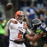Cleveland Browns quarterback Johnny Manziel (2) throws under pressure from Seattle Seahawks' Michael Bennett in the first half of an NFL football game, Sunday, Dec. 20, 2015, in Seattle. (AP Photo/Scott Eklund)