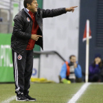 Club Tijuana coach Daniel Guzman calls to his team during the first half of an international friendly soccer match against the Seattle Sounders, Tuesday, March 24, 2015, in Seattle. (AP Photo/Ted S. Warren)
