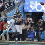 Carolina Panthers defensive back Robert McClain and Seattle Seahawks wide receiver Jermaine Kearse (15) vie for a passed ball during the second half of an NFL divisional playoff football game, Sunday, Jan. 17, 2016, in Charlotte, N.C. (AP Photo/Chuck Burton)