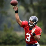Seattle Seahawks quarterback Russell Wilson throws at an NFL football training camp Monday, Aug. 3, 2015, in Renton, Wash. (AP Photo/Elaine Thompson)