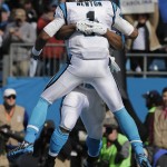 Carolina Panthers quarterback Cam Newton (1) celebrates with Carolina Panthers running back Jonathan Stewart (28) after Stewart scored a touchdown against the Seattle Seahawks during the first half of an NFL divisional playoff football game, Sunday, Jan. 17, 2016, in Charlotte, N.C. (AP Photo/Chuck Burton)