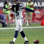 Seattle Seahawks cornerback Richard Sherman (25) celebrates a stop against the Arizona Cardinals during the first half of an NFL football game, Sunday, Jan. 3, 2016, in Glendale, Ariz. (AP Photo/Ross D. Franklin)