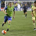 Seattle Sounders forward Jordan Morris, left, tries to outrun Club America defender Paolo Goltz, right, during the second half of a CONCACAF Champions League soccer quarterfinal Tuesday, Feb. 23, 2016, in Seattle. The match ended in a 2-2 draw. (AP Photo/Ted S. Warren)