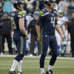 Seattle Seahawks kicker Steven Hauschka, right, and holder Jon Ryan watch as Hauschka's kick bounces off the uprights but still goes through for a field goal  in the first half of an NFL football game against the Carolina Panthers, Sunday, Oct. 18, 2015, in Seattle. (AP Photo/Elaine Thompson)