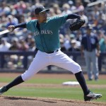 Seattle Mariners starting pitcher Felix Hernandez throws during the first inning of a spring training baseball game against the San Diego Padres in Peoria, Ariz., Wednesday, March 30, 2016. (AP Photo/Jeff Chiu)