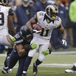 St. Louis Rams' Tavon Austin (11) carries as Seattle Seahawks' K.J. Wright tackles him in the first half of an NFL football game, Sunday, Dec. 27, 2015, in Seattle. (AP Photo/Stephen Brashear)