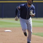 San Diego Padres' Matt Kemp runs to third base during the first inning of a spring training baseball game against the Seattle Mariners in Peoria, Ariz., Wednesday, March 30, 2016. (AP Photo/Jeff Chiu)