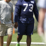 Seattle Seahawks Michael Bowie (73) walks Saturday, Aug. 2, 2014, with Trent Kirchner, Seahawks director of pro personnel during NFL football training camp in Renton, Wash. The team announced Saturday that Bowie would be out 4-6 months due to a shoulder injury. (AP Photo/Ted S. Warren)