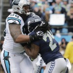 Carolina Panthers defensive tackle Star Lotulelei (98) stops Seattle Seahawks running back Marshawn Lynch (24) during the first half of an NFL divisional playoff football game, Sunday, Jan. 17, 2016, in Charlotte, N.C. (AP Photo/Chuck Burton)