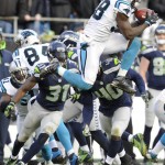 Carolina Panthers outside linebacker Thomas Davis (58) receives an on-side kick from the Seattle Seahawks during the second half of an NFL divisional playoff football game, Sunday, Jan. 17, 2016, in Charlotte, N.C. The Panthers won 31-24. (AP Photo/Mike McCarn)