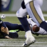 Seattle Seahawks quarterback Russell Wilson (3) fumbles in the second half of an NFL football game against the St. Louis Rams, Sunday, Dec. 27, 2015, in Seattle. (AP Photo/Stephen Brashear)
