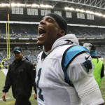 Carolina Panthers quarterback Cam Newton (1) celebrates after the Panthers beat the Seattle Seahawks 27-23 in an NFL football game, Sunday, Oct. 18, 2015, in Seattle. (AP Photo/Stephen Brashear)