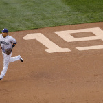 San Diego Padres shortstop Everth Cabrera runs past a number "19" etched into the infield to honor former Padres' Tony Gwynn in the first inning during a baseball game against the Seattle Mariners Monday, June 16, 2014, in Seattle. It was announced earlier Monday that Gwynn, who had more than 3,100 hits during a career spanning two decades, died at age 54 following a battle with oral cancer. (AP Photo/Elaine Thompson)