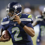 Seattle Seahawks quarterback Terrelle Pryor runs for a touchdown against the San Diego Chargers in the second half of a preseason NFL football game, Friday, Aug. 15, 2014, in Seattle. (AP Photo/Stephen Brashear)