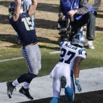 Seattle Seahawks wide receiver Jermaine Kearse (15) makes a touchdown catch against Carolina Panthers defensive back Robert McClain (27) during the second half of an NFL divisional playoff football game, Sunday, Jan. 17, 2016, in Charlotte, N.C.  (AP Photo/Bob Leverone)