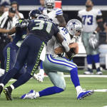 Seattle Seahawks strong safety Kam Chancellor (31) tackles Dallas Cowboys' Matt Cassel (16) after a short scramble and run in the first half of an NFL football game Sunday, Nov. 1, 2015, in Arlington, Texas. (AP Photo/Michael Ainsworth)