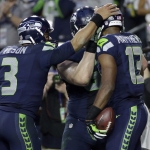 Seattle Seahawks quarterback Russell Wilson (3) celebrates a touchdown with wide receiver Chris Matthews (13) during the first half of NFL Super Bowl XLIX football game against the New England Patriots Sunday, Feb. 1, 2015, in Glendale, Ariz. (AP Photo/Matt Slocum)