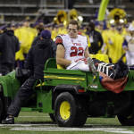 Utah's Chase Hansen is taken off the field on a cart after suffering an injury on the final play of an NCAA college football game against Washington, Saturday, Nov. 7, 2015, in Seattle. Utah beat Washington 34-23. (AP Photo/Ted S. Warren)