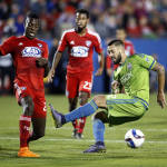 FC Dallas defender Je-Vaughn Watson, left, blocks a shot by Seattle Sounders FC forward Clint Dempsey (2) during the first half of an MLS soccer western conference semifinal playoff match Sunday, Nov. 8, 2015, in Frisco, Texas. (AP Photo/Brad Loper)